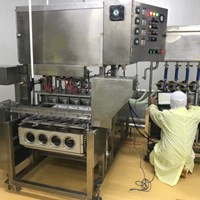 Máy chiết rót và hàn miệng tô hút chân không
